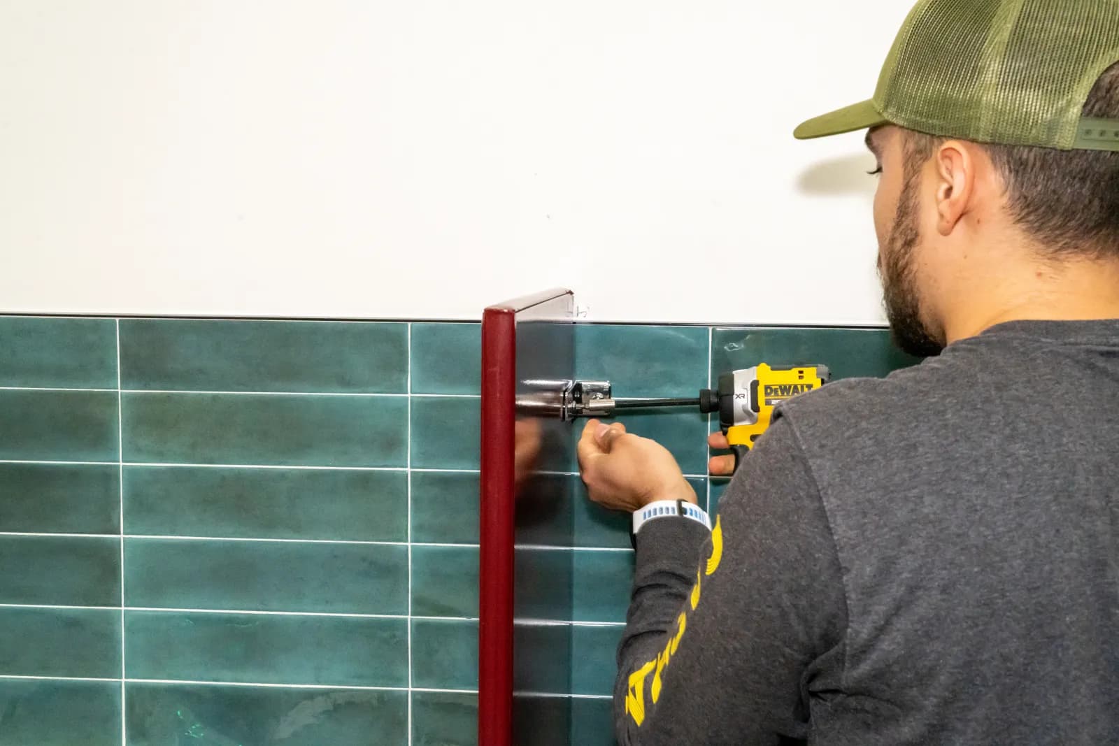 A Partition Pros installer fitting hardware with care